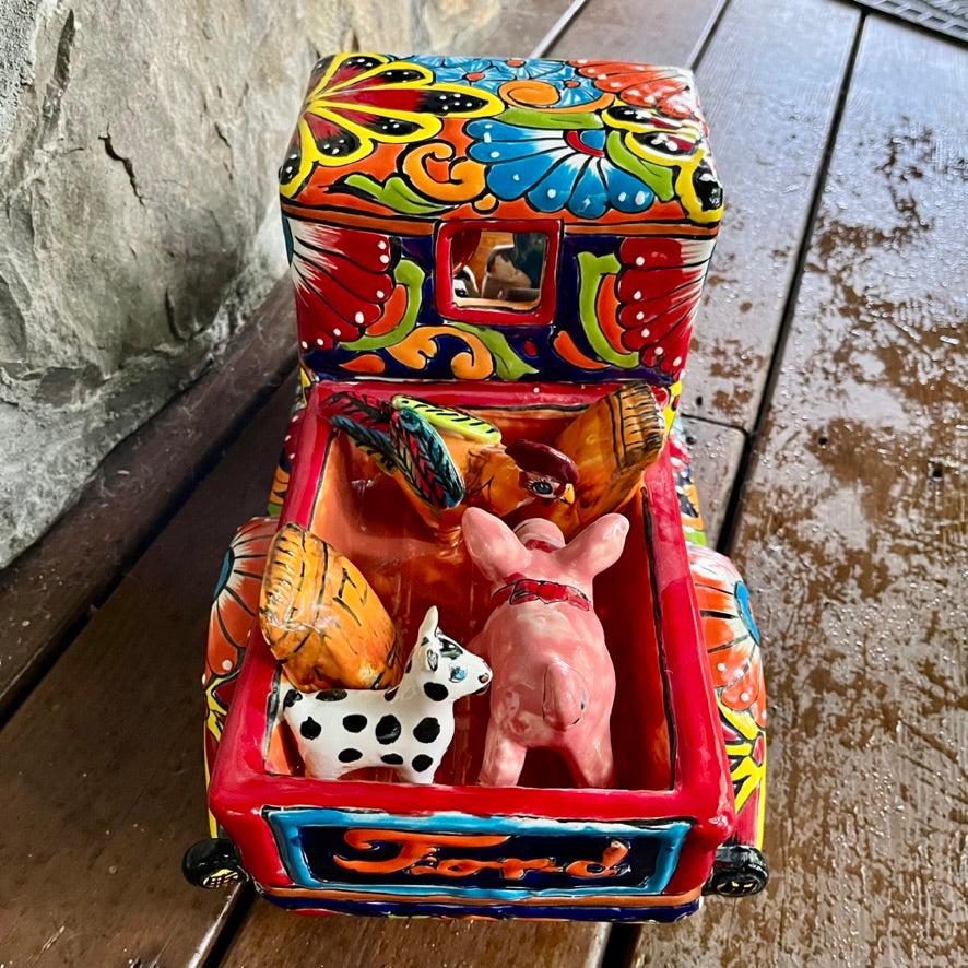 mexican talavera pick up truck with catrina skeltons cargo bay with animals