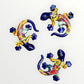 Three colorful ceramic lizards on a white background