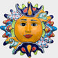 Decorative Talavera sun-shaped wall art with colorful face design on a white background
