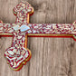 Milagros decorated wood cross left side view