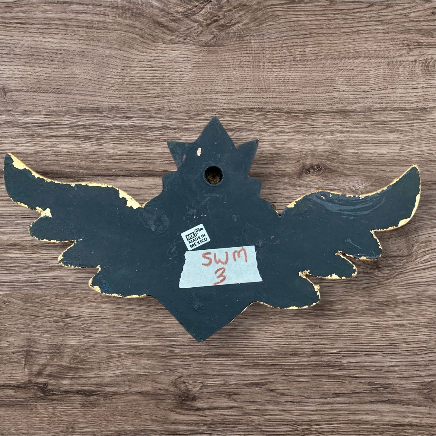 Milagros decorated flying sacred heart back