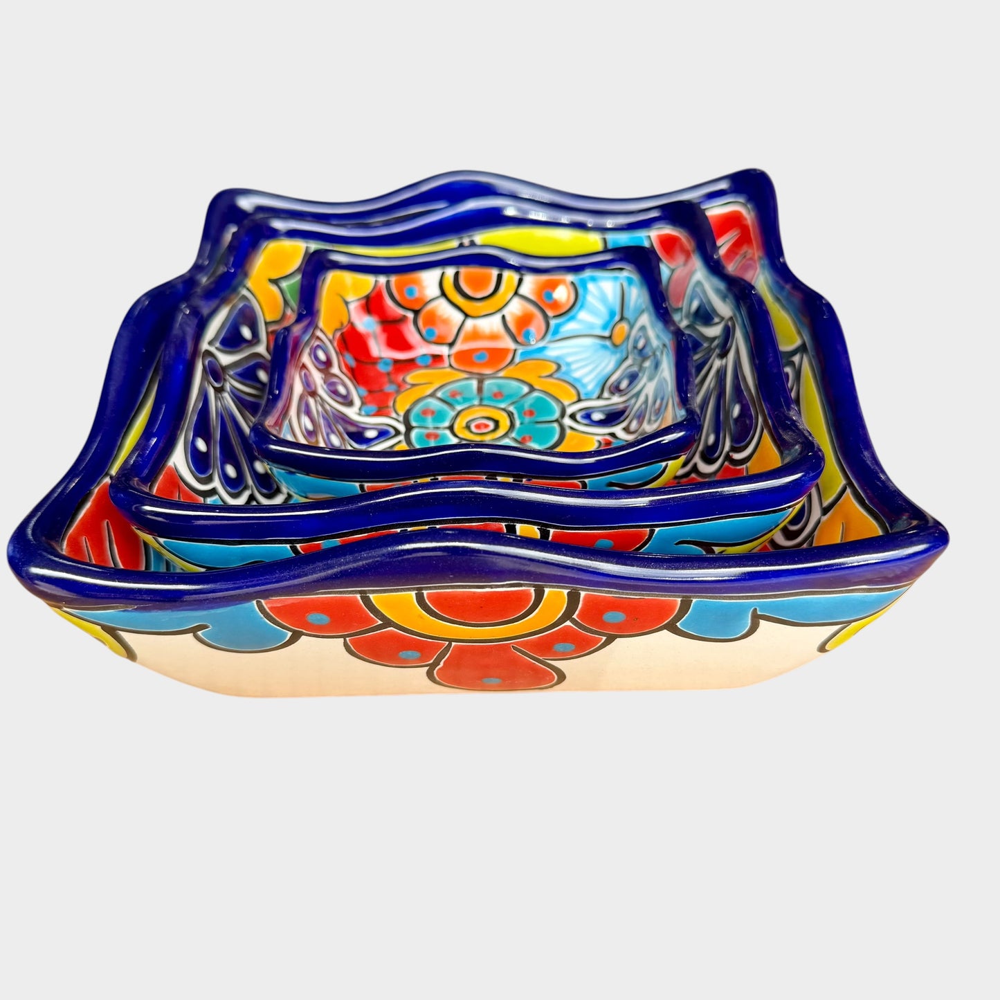 Three colorful talavera square nesting bowls with intricate patterns Side view