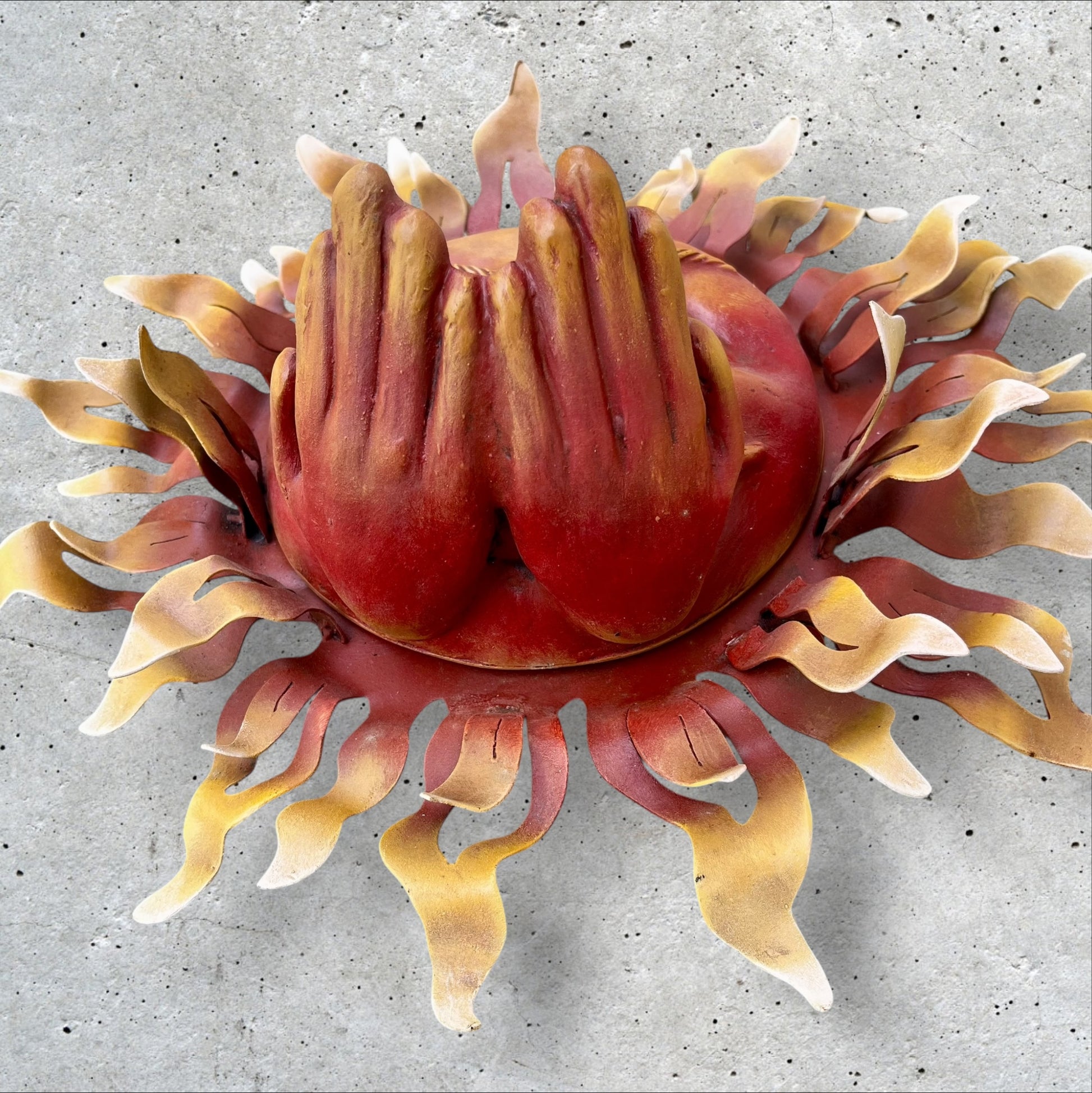 Metal wall art sun with hands bottom of hands