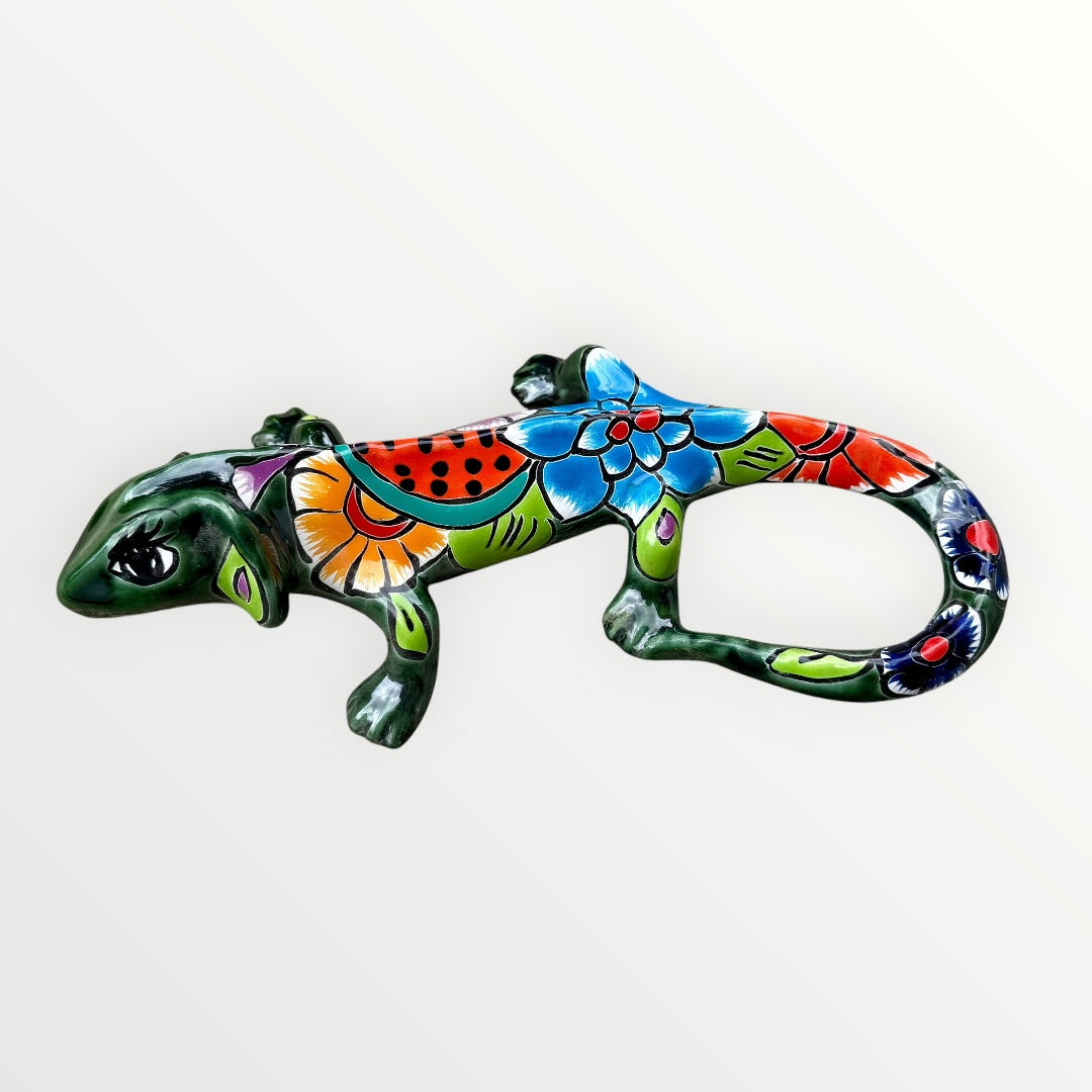 Mexican Talavera wall mounted iguana in dark green with multicolor designs bright side view of iguana 