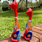 Two colorful talavera kittens from the back view.