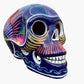 Colorful Mexican Sugar skull purple with vibrant designs on a white background