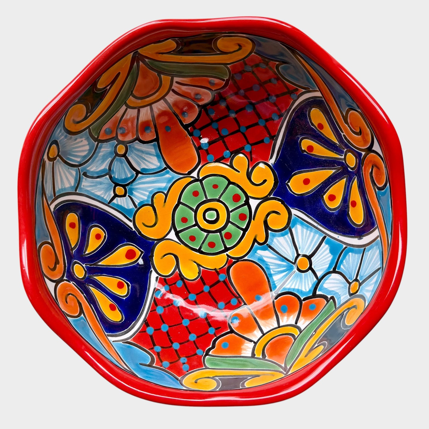 Three colorful talavera nesting bowls with intricate patterns Large bowl