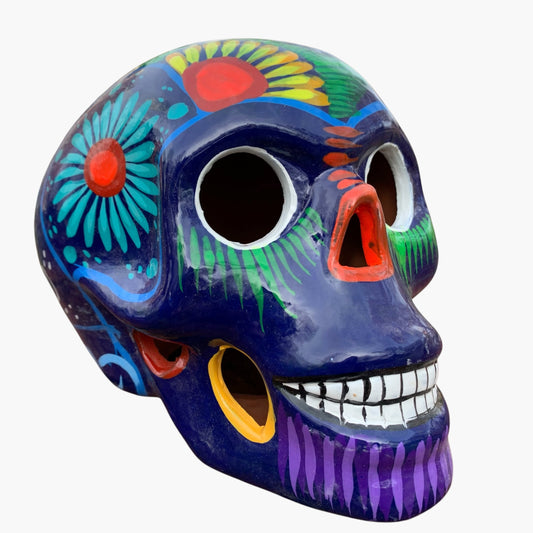 Colorful Mexican Sugar skull purple with vibrant designs on a white background