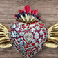 Milagros decorated sacred heart with wings center