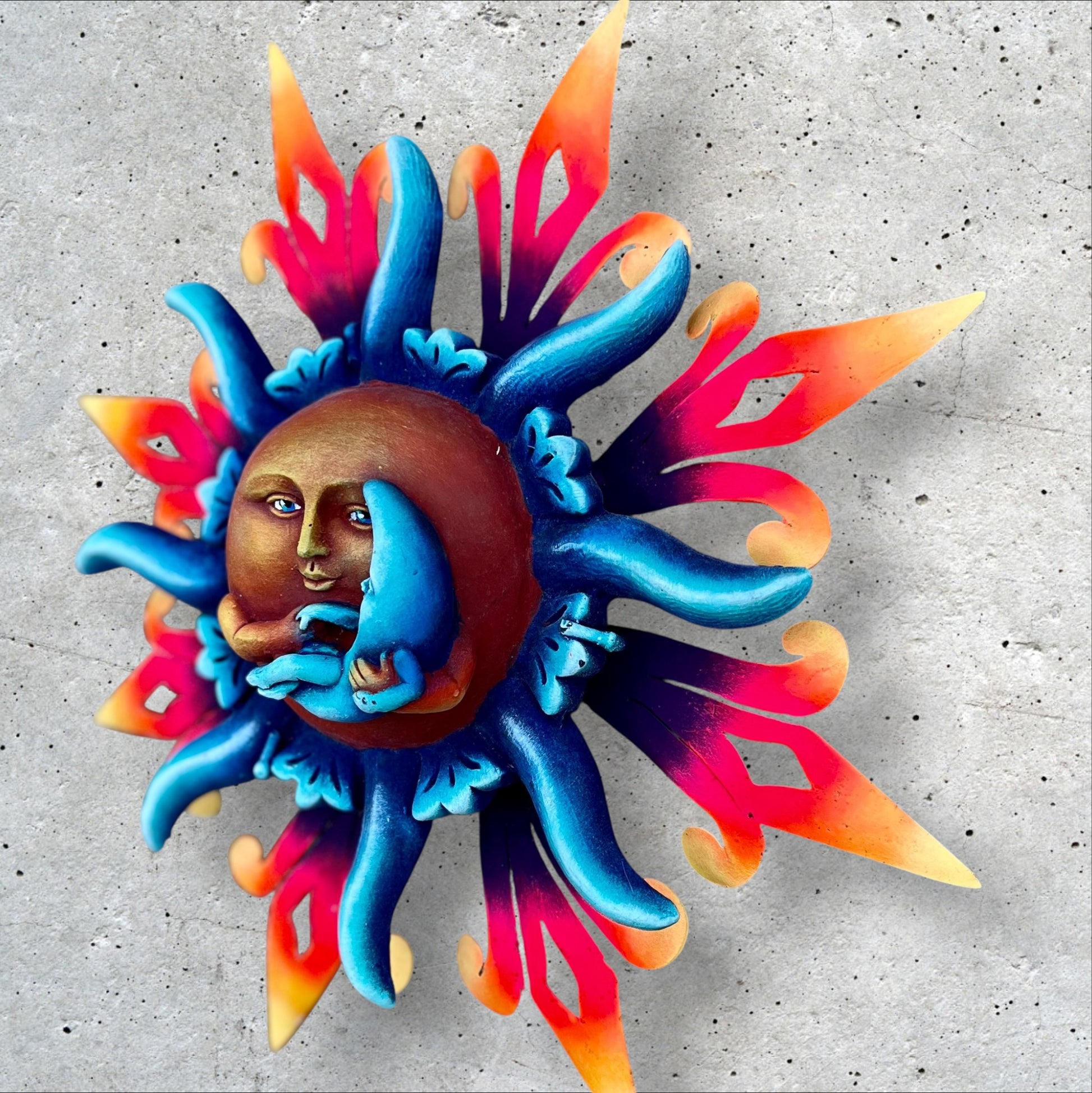 Peaceful sun holding moon right