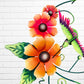 Decorative metal wall art with orange flowers and a hummingbird on a white brick background flower close up