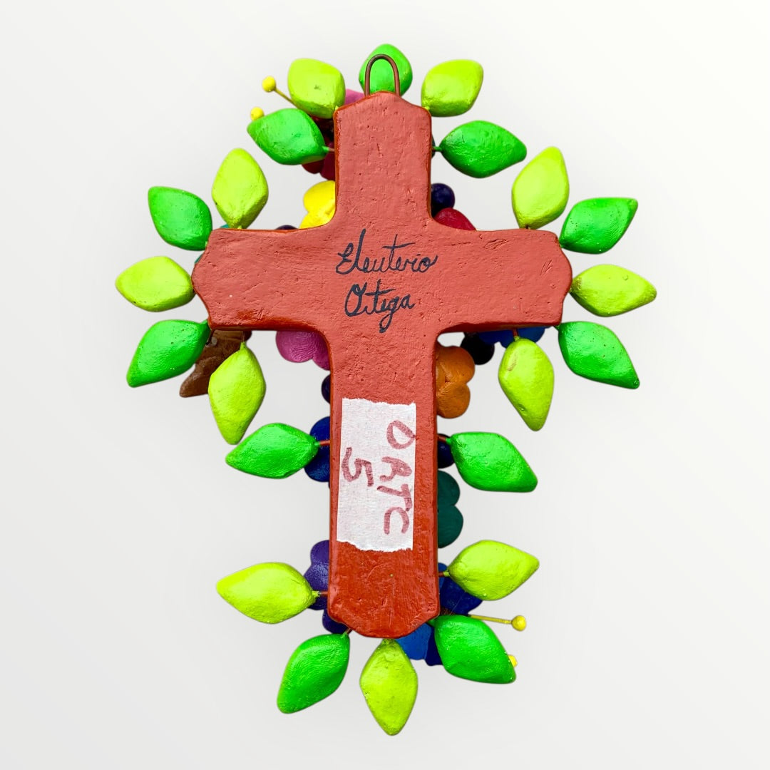 Ortega Family Folk Art Cross with colorful flowers, leaves, birds and butterflies. Cross base is a red color signed back