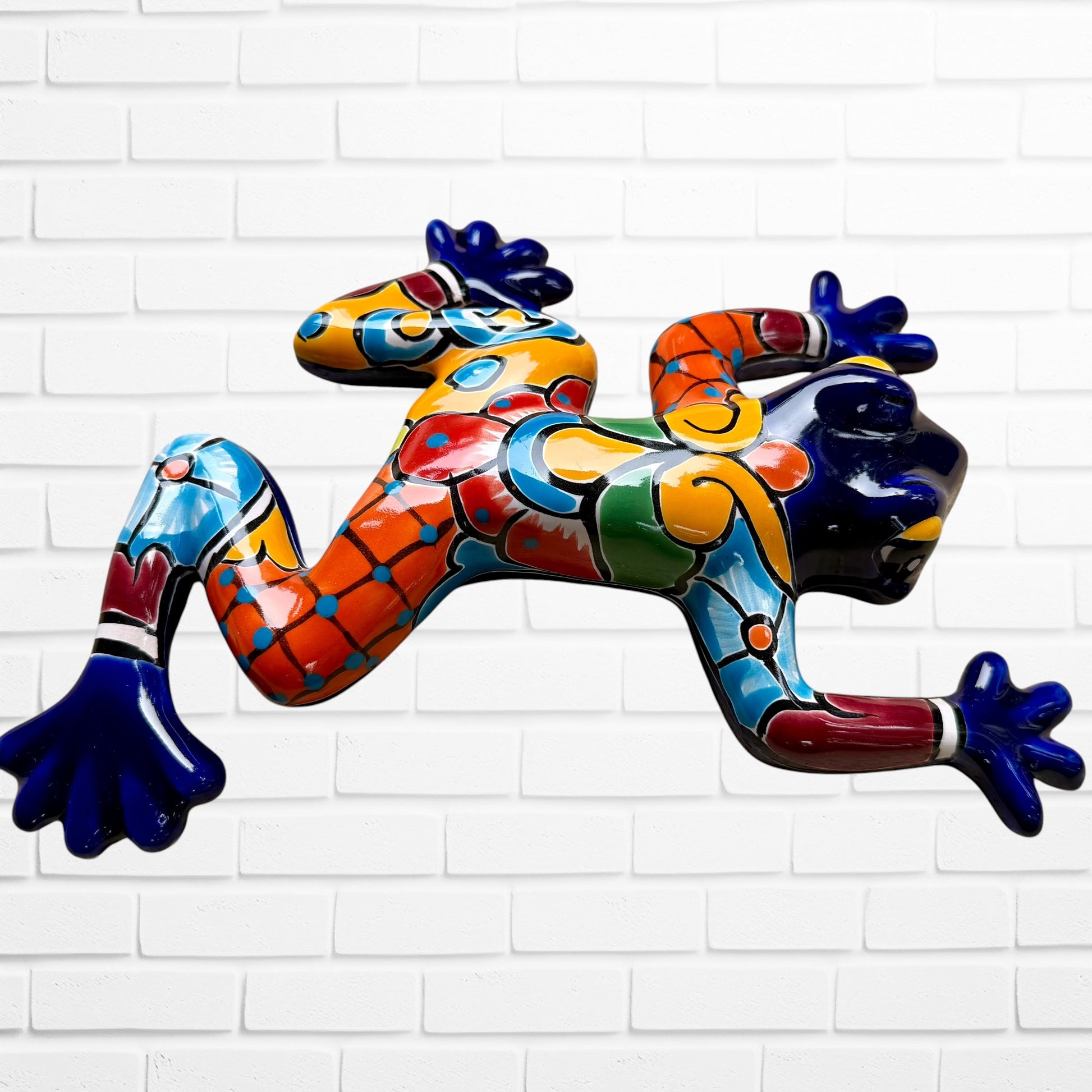 Dark blue Talavera wall frog with multicolor designs left side view