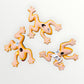 Three colorful ceramic frogs on a white background Back view