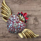 Milagros decorated sacred heart with wings