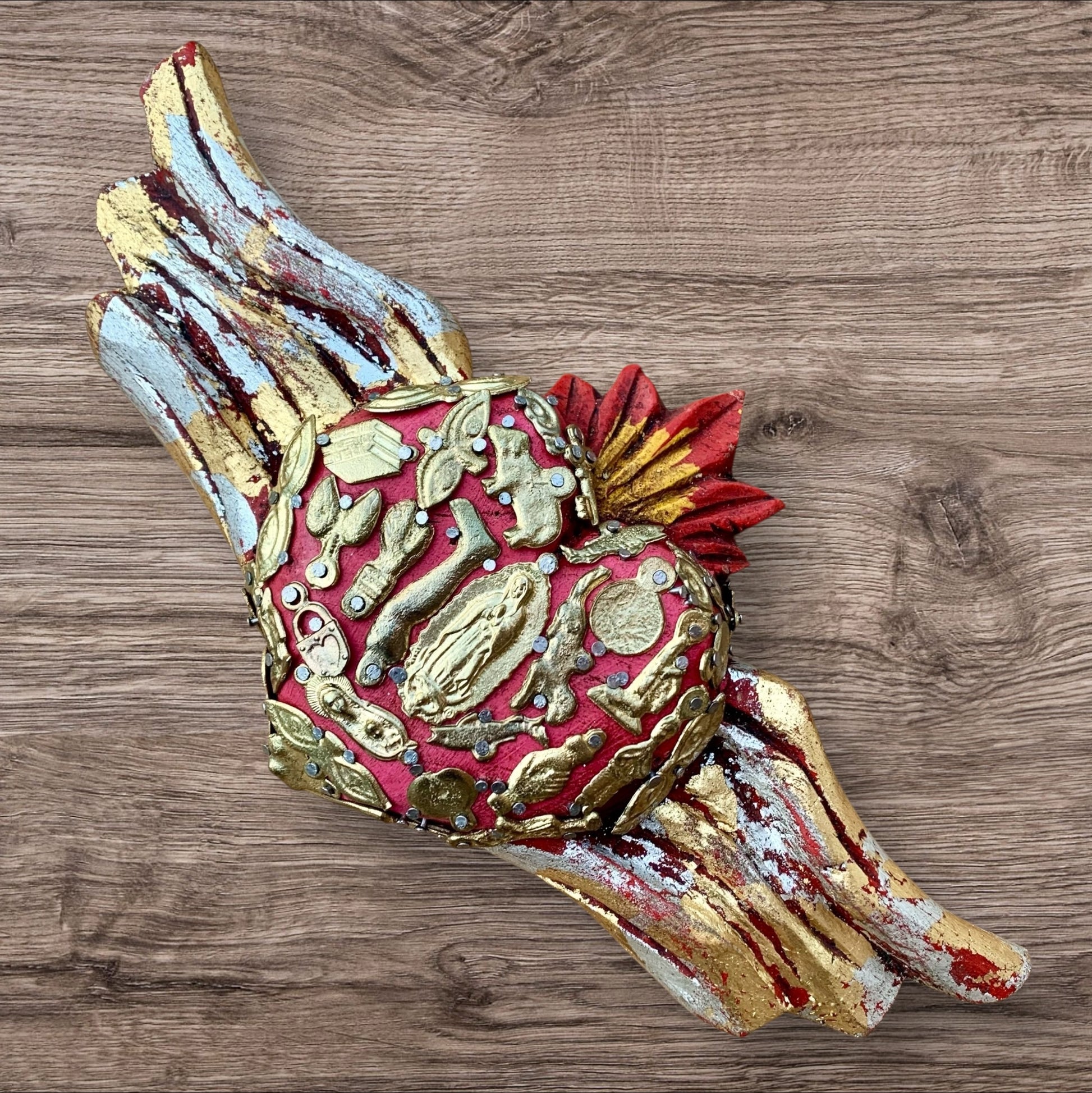 Milagros winged heart with guadalupe in center