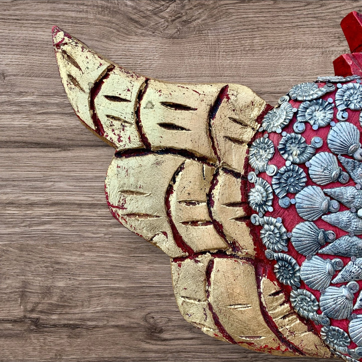 Winged Milagros sacred heart with center heart charm surrounded by sea shells Left wing