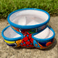 Hand painted Mexican Talavera Strawberry pot with a large top opening a four pockets on each side.  Trim color is turquoise body has multi-color designs. This is the other side view.