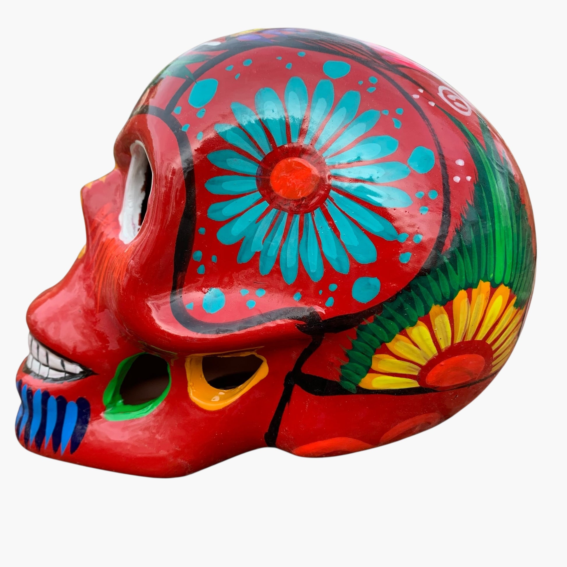 Colorful skull-shaped object with floral patterns on a white background side 