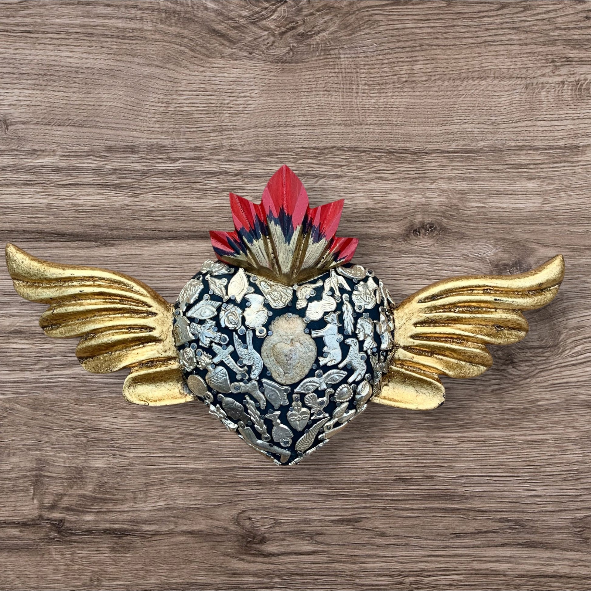 Milagros decorated sacred heart with wings front