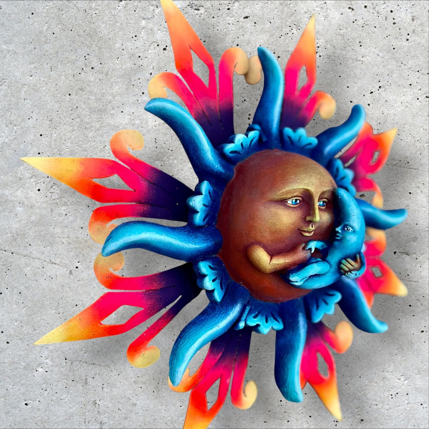 Peaceful sun holding moon left side