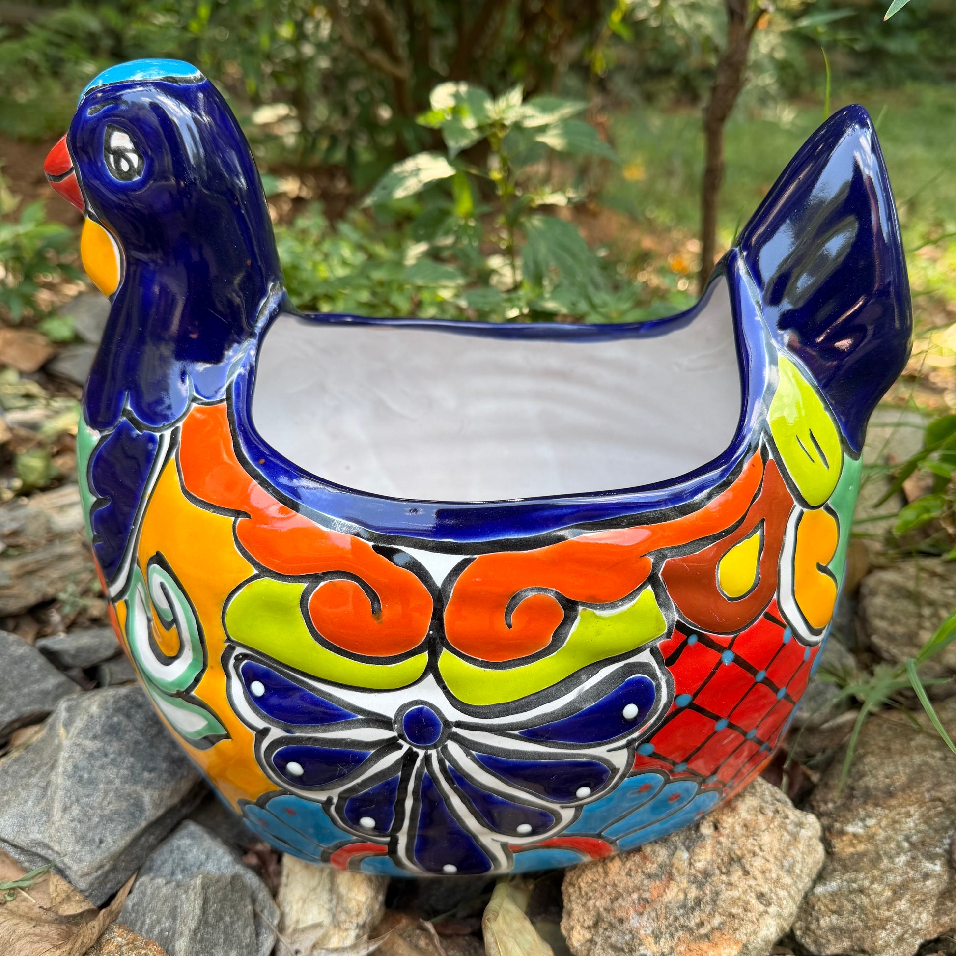 Colorful Mexican Talavera ceramic chicken shape planter on a natural background Right side