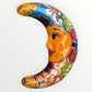 Decorative ceramic moon with colorful patterns on a white background face view