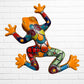 A talavera wall frog in yellow with multicolor designs on the body.