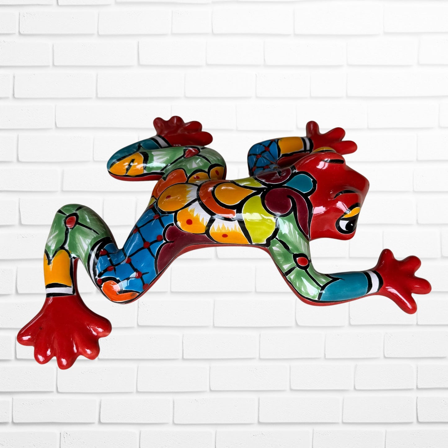 Read Mexican Talavera wall frog with multi color Designs left side view