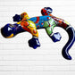 A colorful, glossy lizard wall sculpture with 
a vibrant mosaic pattern of blue, orange, yellow, green, red, and black, mounted on a white brick wall front view

