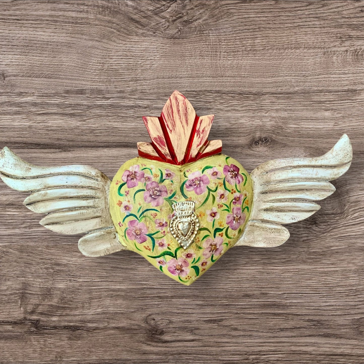 Milagros decorated sacred heart with wings front