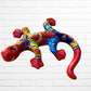 Colorful lizard-shaped wall art against a white brick wall background side view