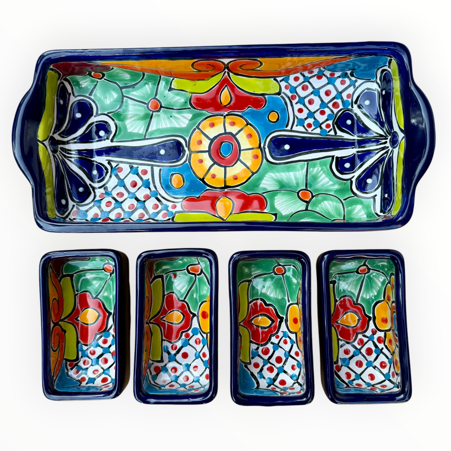 A sectional, rectangle Talavera hand-painted serving fish with a deep rectangular dish and four shallow rectangular sections, decorated with vibrant floral and geometric patterns in blue, red, green, yellow, and orange, top view showing sections.