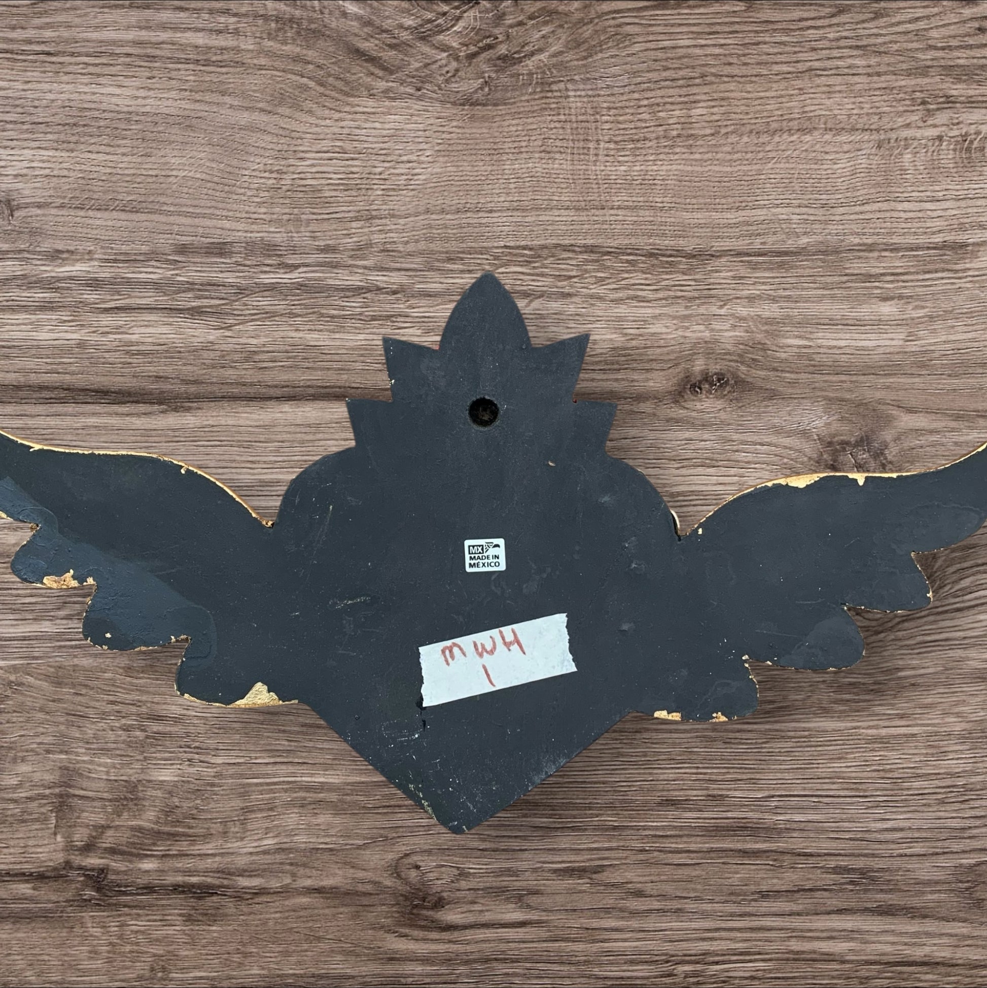 Milagros decorated sacred heart with wings back