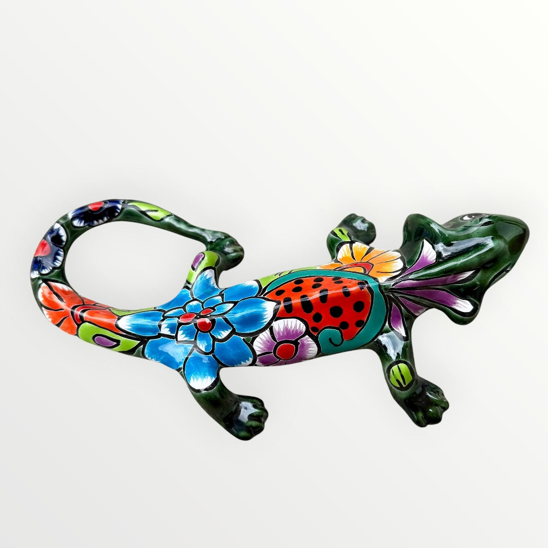 Mexican Talavera wall mounted iguana in dark green with multicolor designs left side view of iguana 