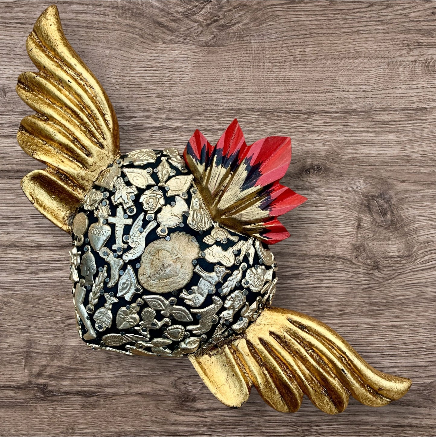 Milagros decorated sacred heart with wings