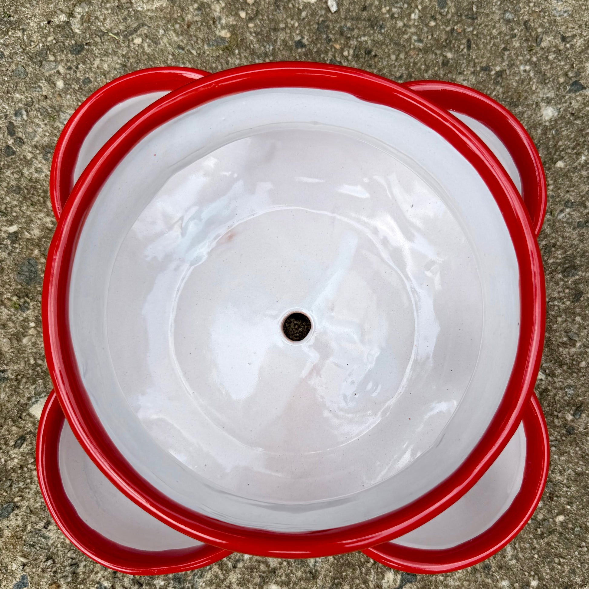 Hand painted Mexican Talavera Strawberry pot with a large top opening a four pockets on each side.  Trim color is cherry red, body has multi-color designs on each side. Photo shows top opening.