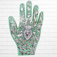 Decorative palm with intricate silver designs on a green background light green