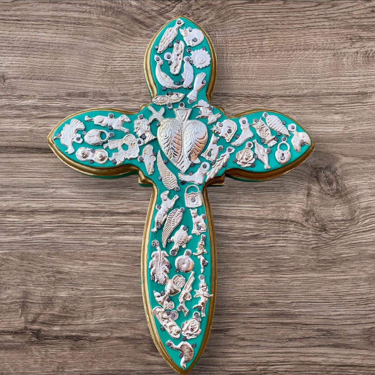 Milagros decorated wood cross blueish green