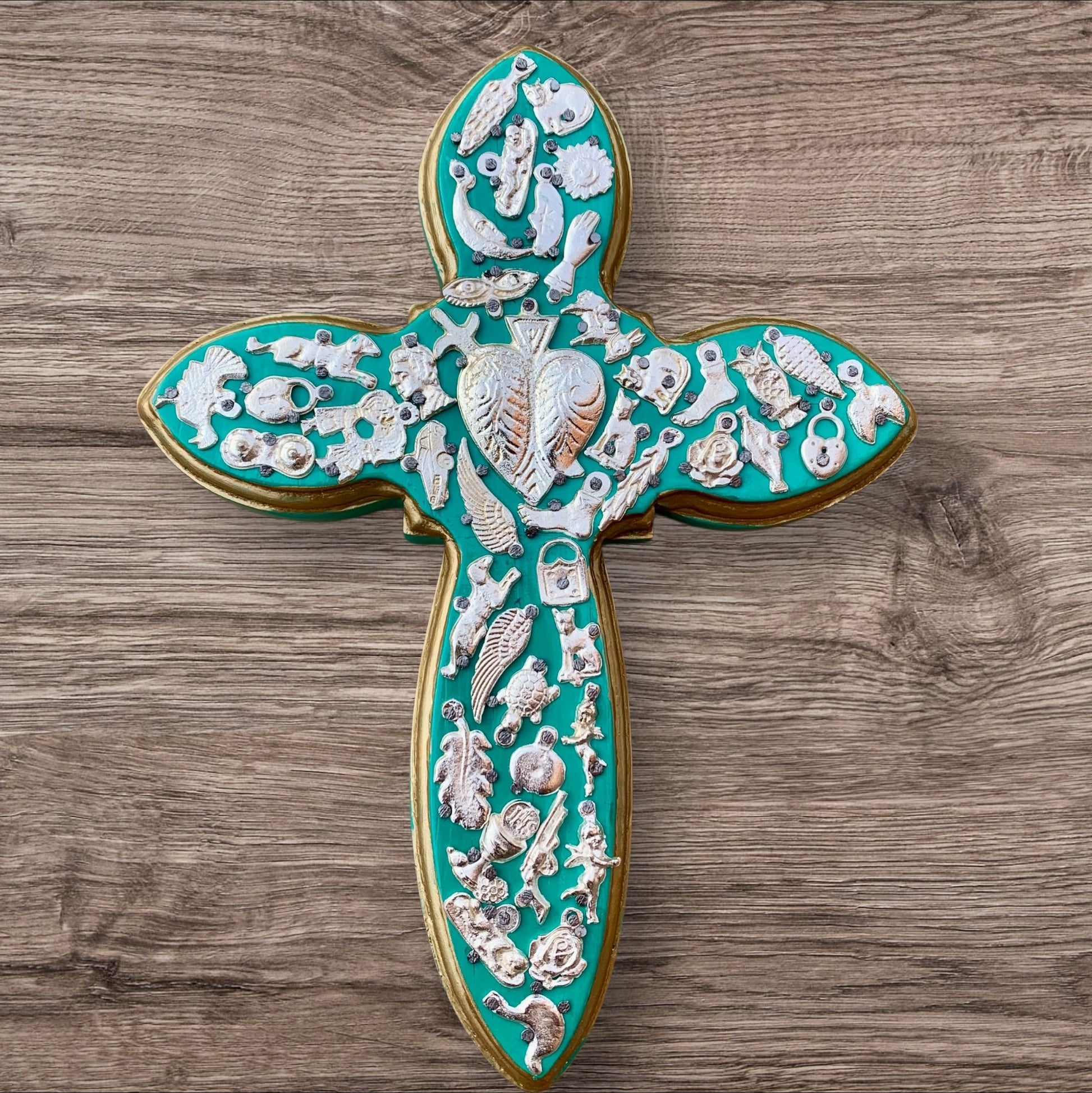 Milagros decorated wood cross blueish green
