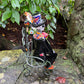 Mexican talavera catrina man and women on bench other side