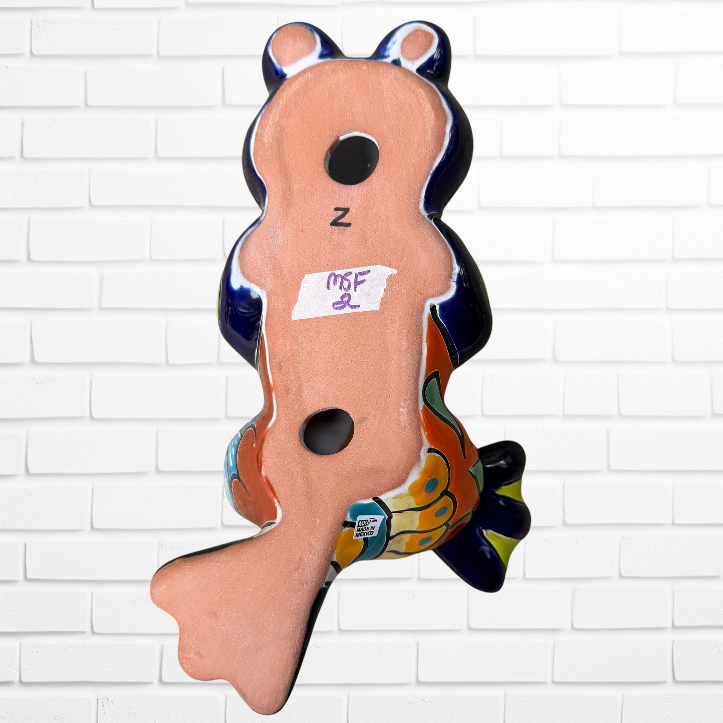 Mexican Talavera, silly, dancing, frog back view with hanging holes.