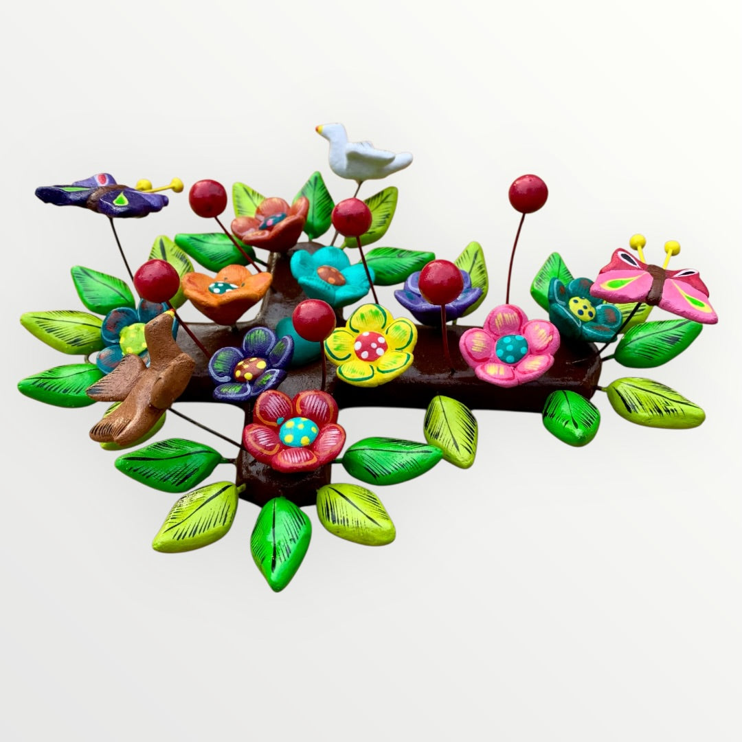 Ortega Family Folk Art Cross with colorful flowers, leaves, birds and butterflies. Cross base is cafe color, side 3D view