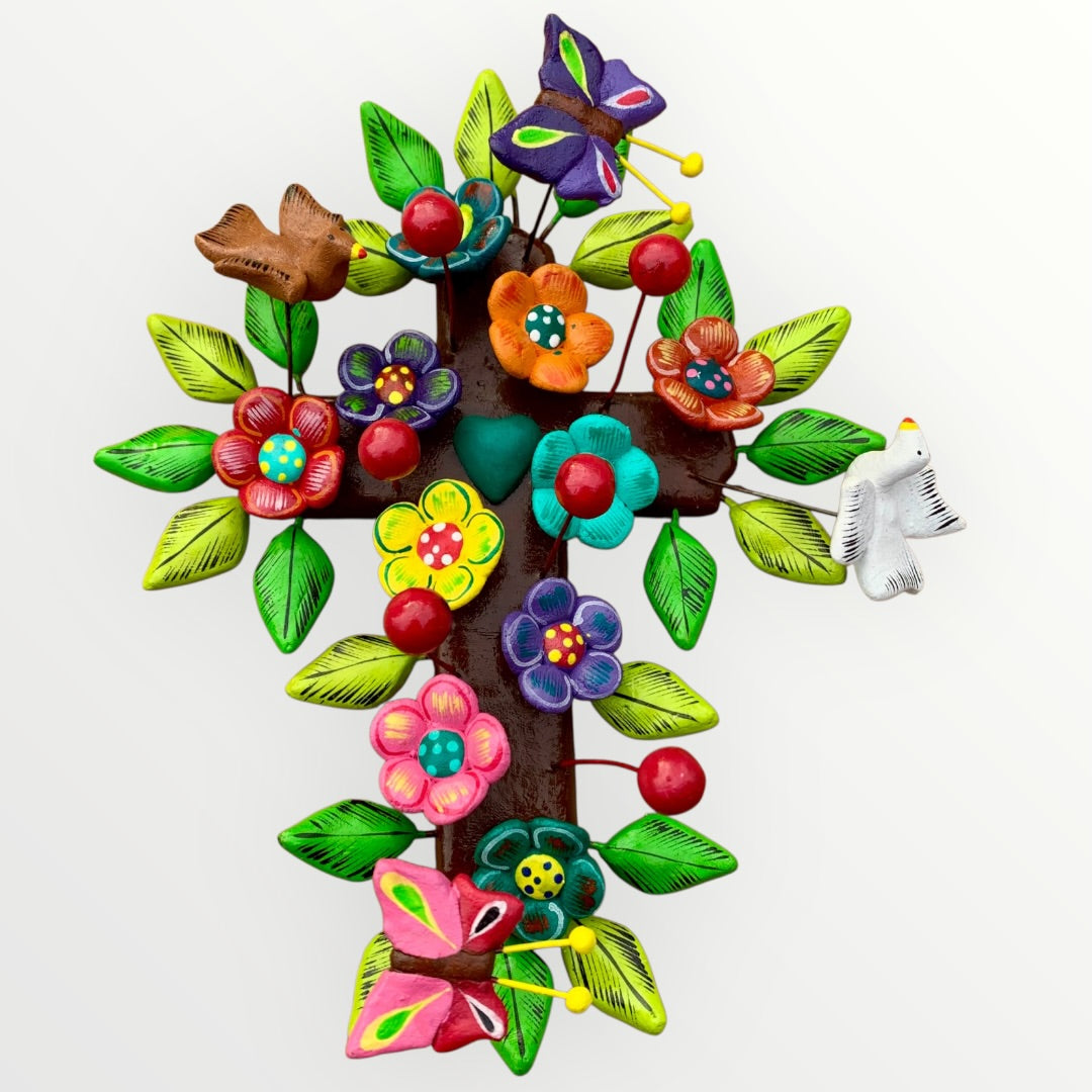 Ortega Family Folk Art Cross with colorful flowers, leaves, birds and butterflies. Cross base is cafe color