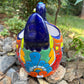 Colorful Mexican Talavera ceramic chicken shape planter on a natural background Back view