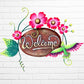 Decorative 'Welcome' sign with pink flowers and a hummingbird on a white brick wall background.