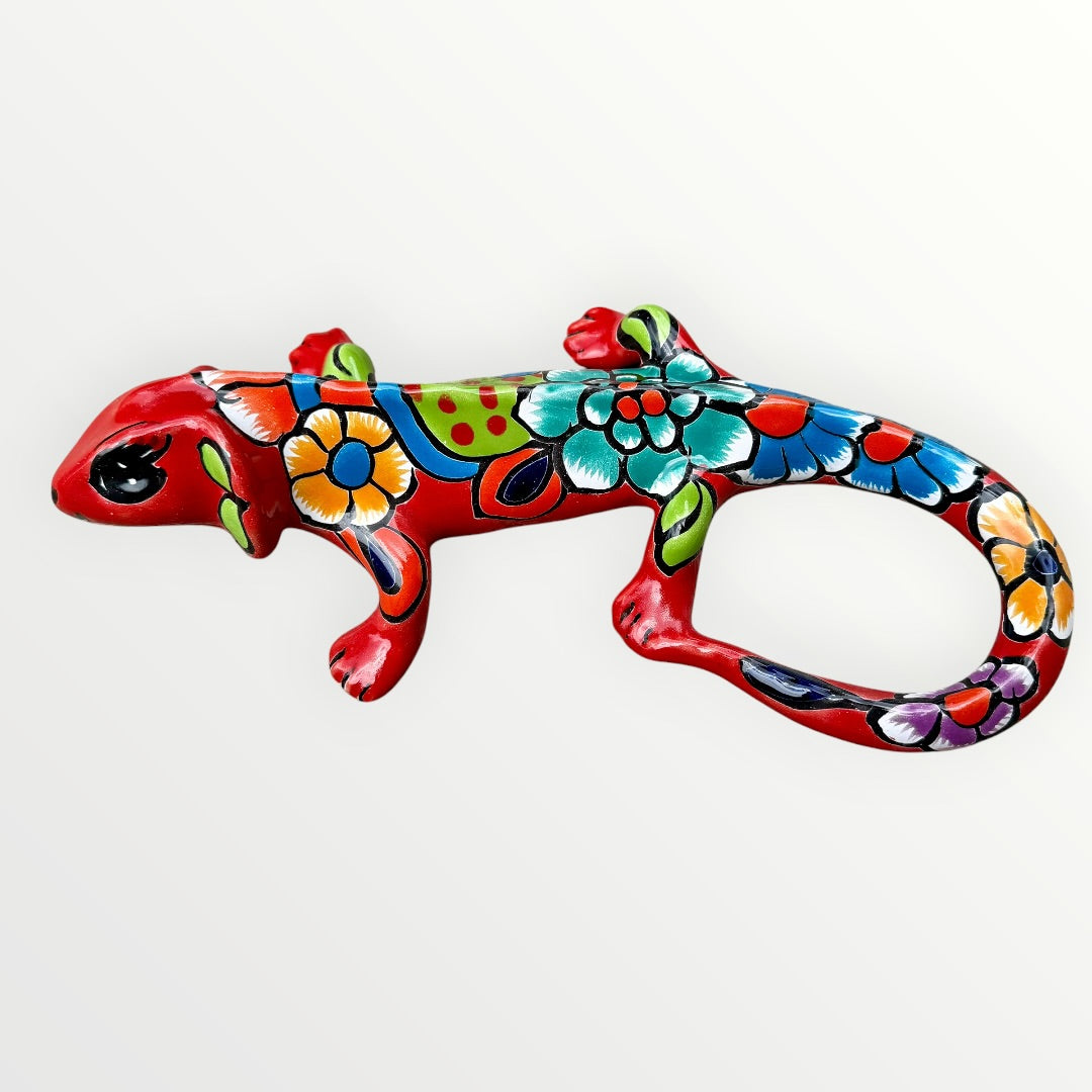 Mexican Talavera wall mounted iguana in bright red with multicolor designs right side view