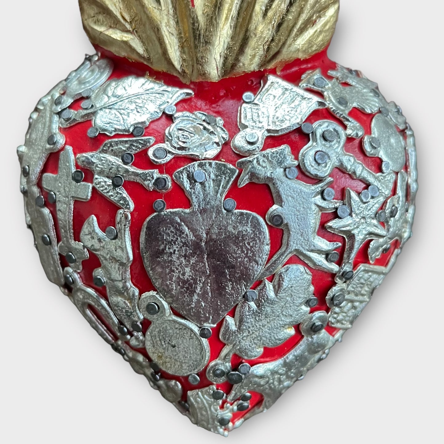 Milagros charms wood heart close up