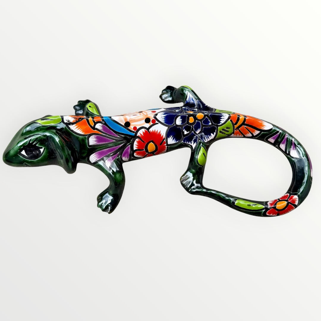 Mexican Talavera wall mounted iguana in dark green with multicolor designs right side view.