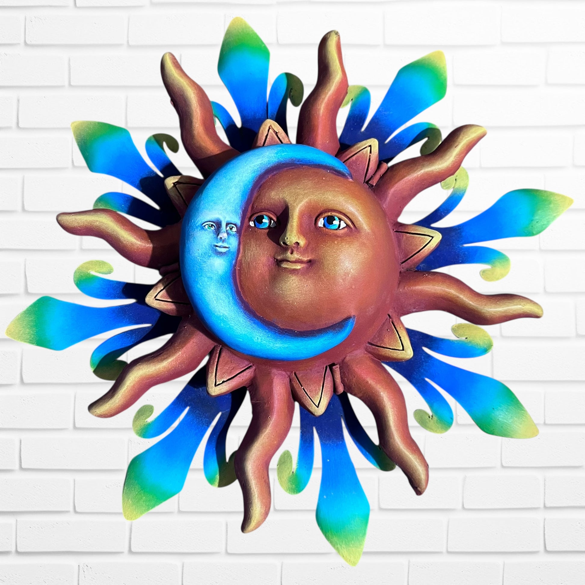 Handcrafted metal sun with vibrant blue moon Wall art